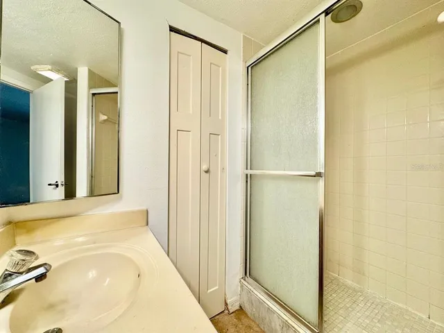 a bathroom with a tub and shower
