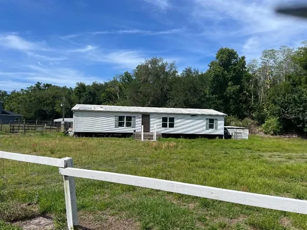 a house view with a garden space