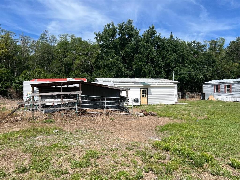 15617 Casey Road Tampa, FL 33624 - Photo 6 of 8 a view of a house with a yard and sitting area