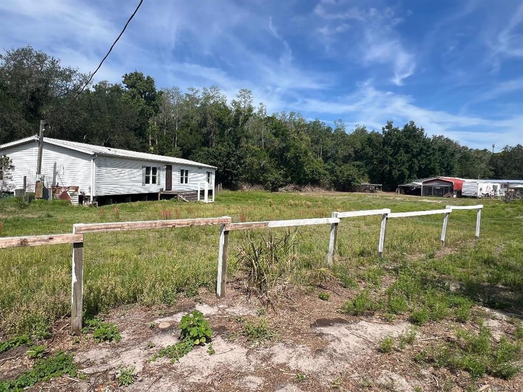 15617 Casey Road Tampa, FL 33624 - Photo 7 of 8 a view of a lake with a house in the background