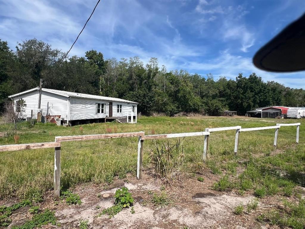 15617 Casey Road Tampa, FL 33624 - Photo 8 of 8 a view of a house with a yard