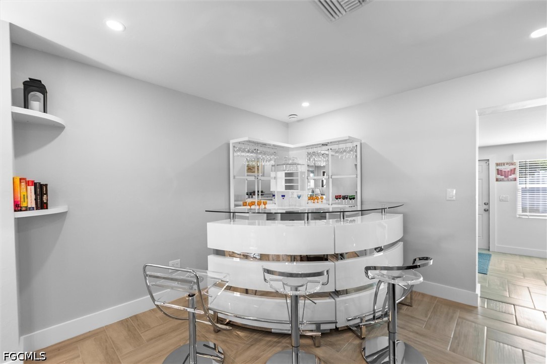 1200 Patterson Road Cape Coral, FL 33909 - Photo 11 of 42 a view of kitchen with dining area