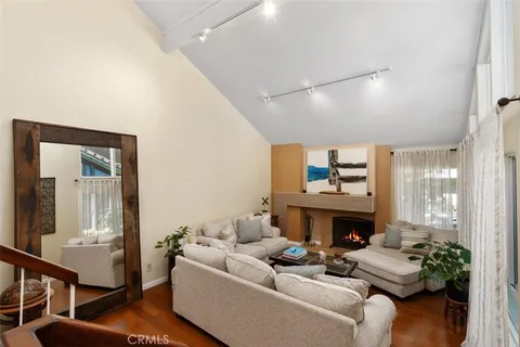 a view of entryway dining room and hall with wooden floor