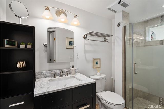 a view of a balcony dining table and chairs