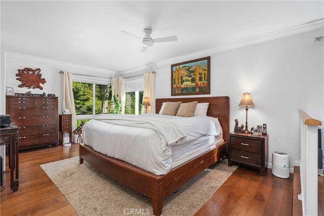 a large kitchen with kitchen island a sink a counter and a large mirror