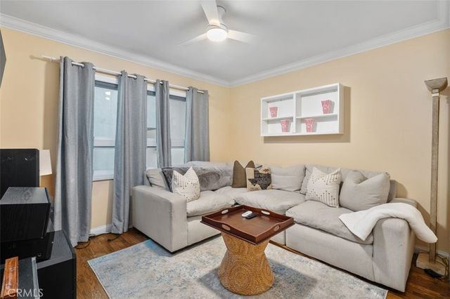 a spacious bedroom with a bed and a chandelier