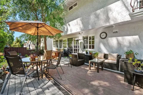 an outdoor space with patio couch and chairs