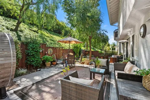 a view of a backyard with sitting area