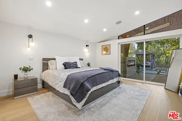 a bathroom with a toilet sink shower and mirror