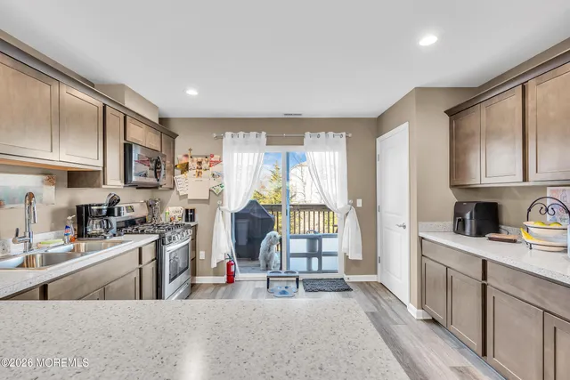 a kitchen with sink cabinets and outdoor view