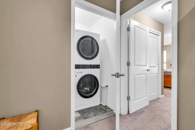 a view of a hallway with washer and dryer