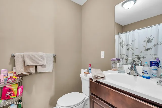 a bathroom with a sink toilet and vanity