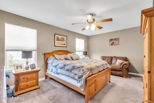 a bathroom with a shower a toilet and a sink