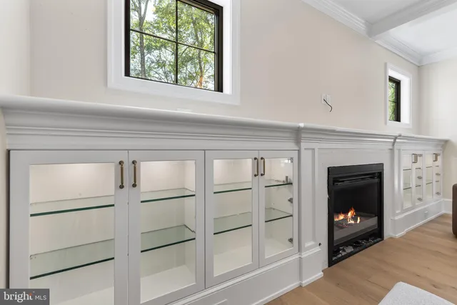 a spacious bathroom with double vanity and a large mirror