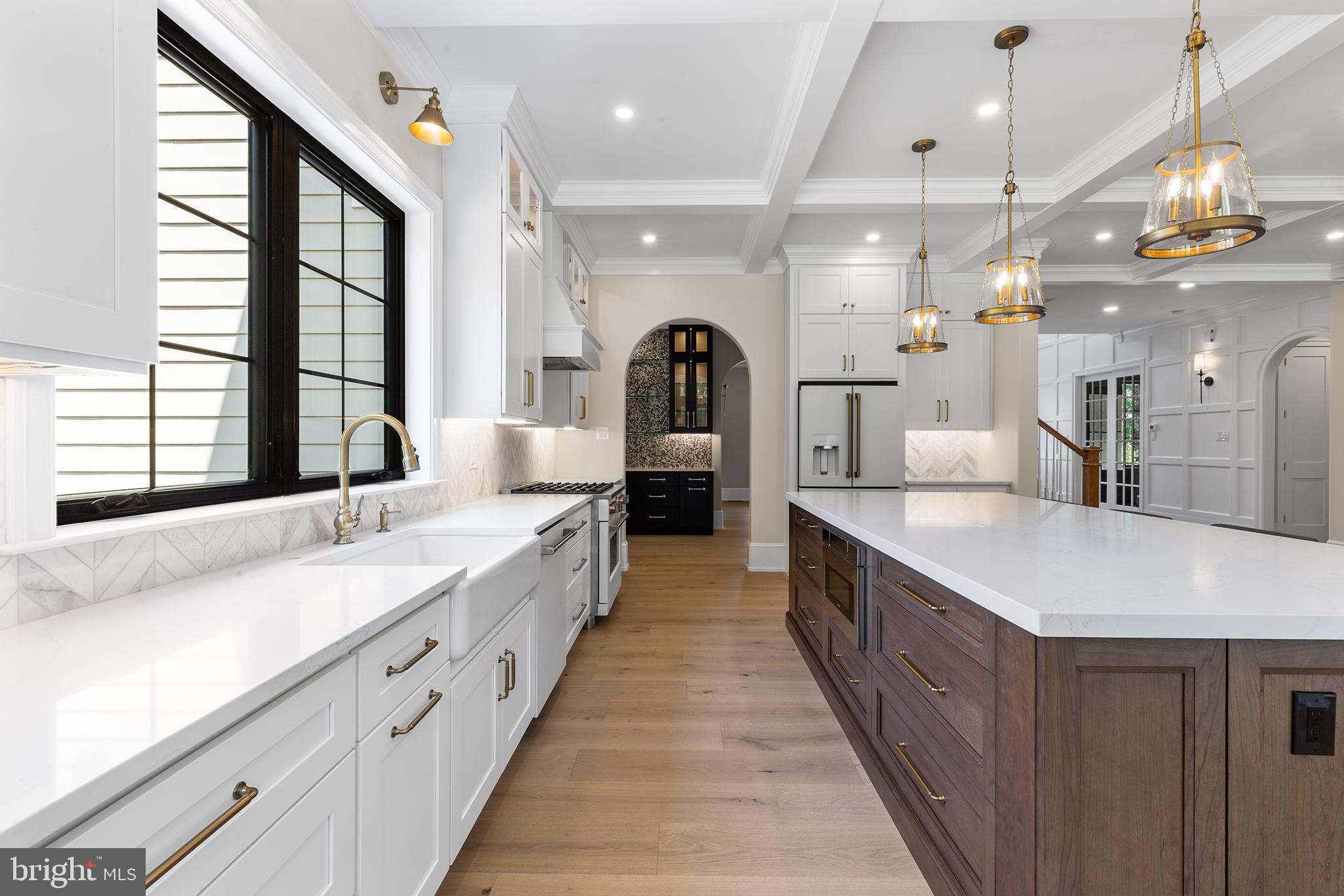 153 Kirk Road Garnet Valley, PA 19060 - Photo 20 of 66 a large kitchen with kitchen island a large island in it