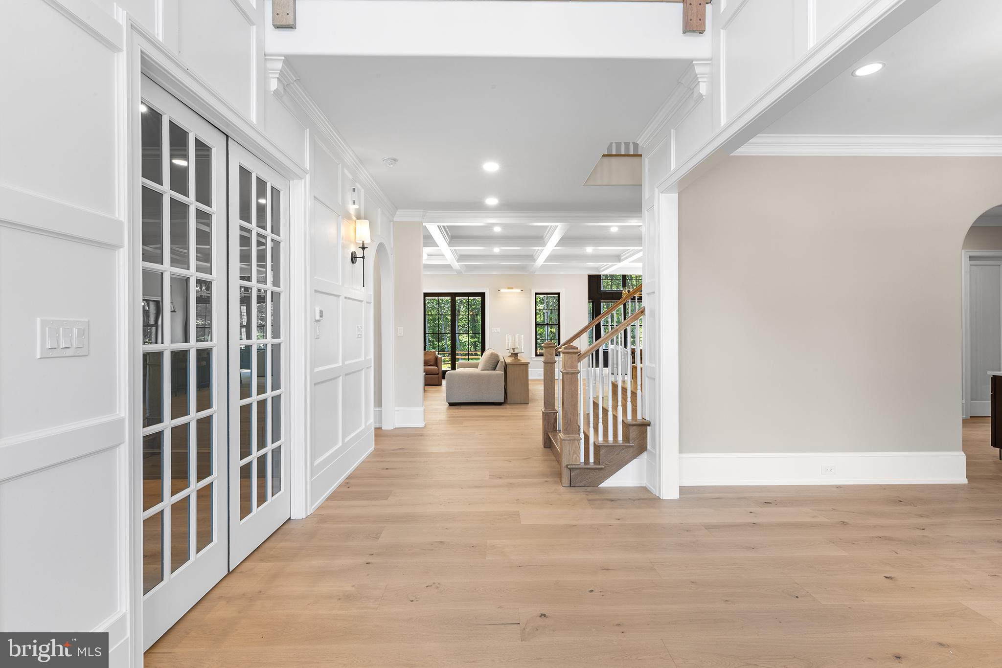 153 Kirk Road Garnet Valley, PA 19060 - Photo 2 of 66 a view of a hallway with wooden floor and windows