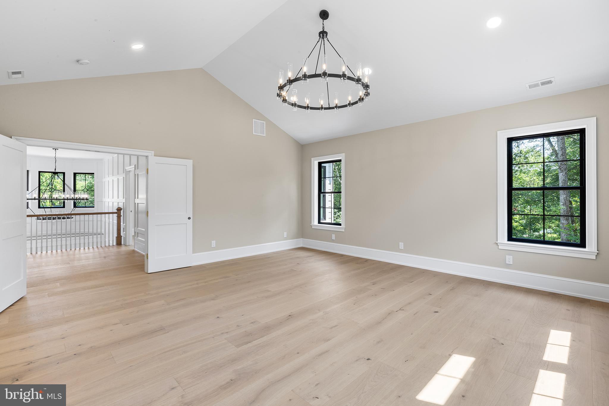 153 Kirk Road Garnet Valley, PA 19060 - Photo 26 of 66 an empty room with wooden floor fan and windows