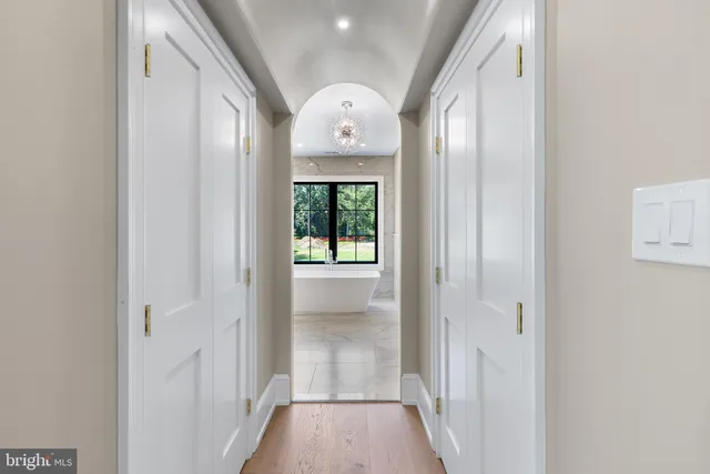 a bathroom with a granite countertop sink mirror and a window