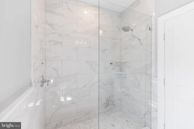 an aerial view of a house with swimming pool and big yard