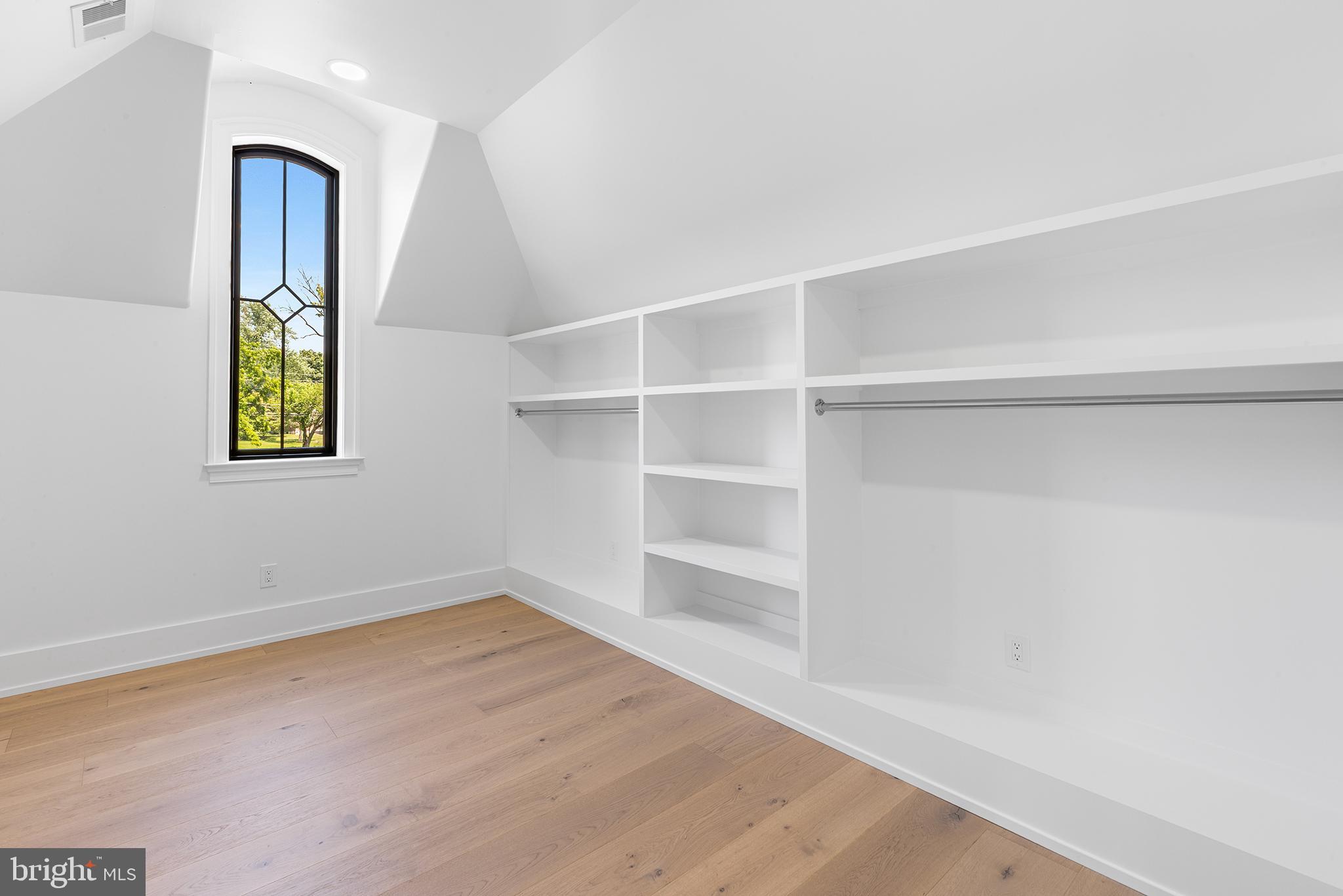 153 Kirk Road Garnet Valley, PA 19060 - Photo 40 of 66 a view of an empty room with window and wooden floor