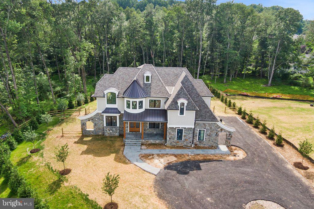 153 Kirk Road Garnet Valley, PA 19060 - Photo 53 of 66 an aerial view of a house with swimming pool and big yard