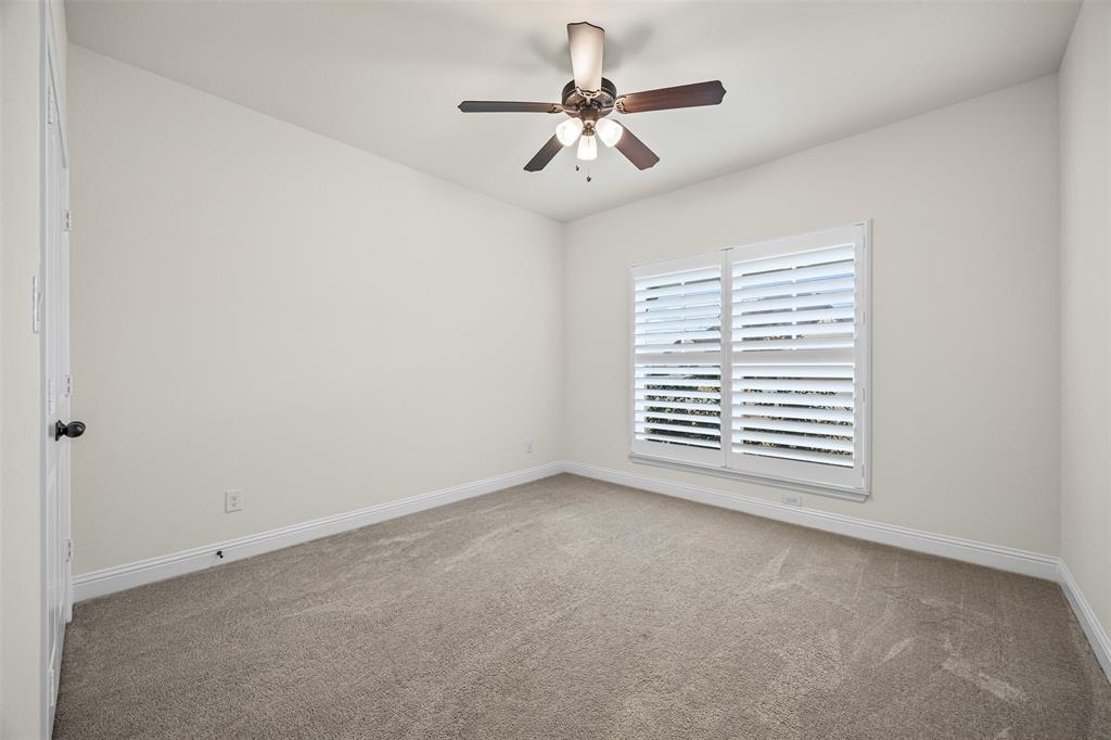 9437 Wildcat Ridge Godley, TX 76044 - Photo 17 of 37 a view of a big room with windows and chandelier fan