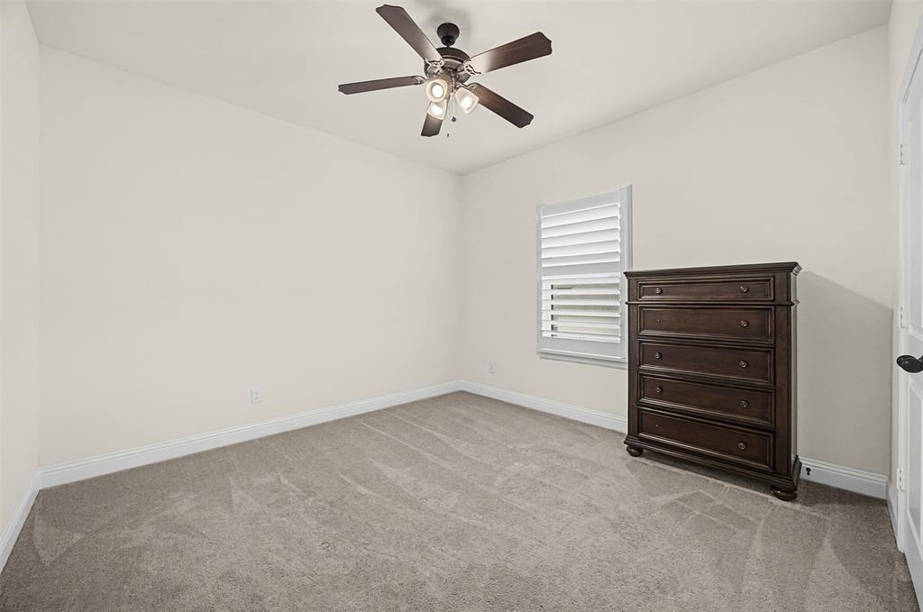 9437 Wildcat Ridge Godley, TX 76044 - Photo 20 of 37 an empty room with a ceiling fan