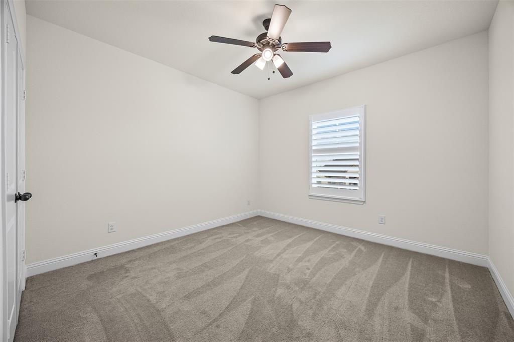 9437 Wildcat Ridge Godley, TX 76044 - Photo 23 of 37 an empty room with windows and fan
