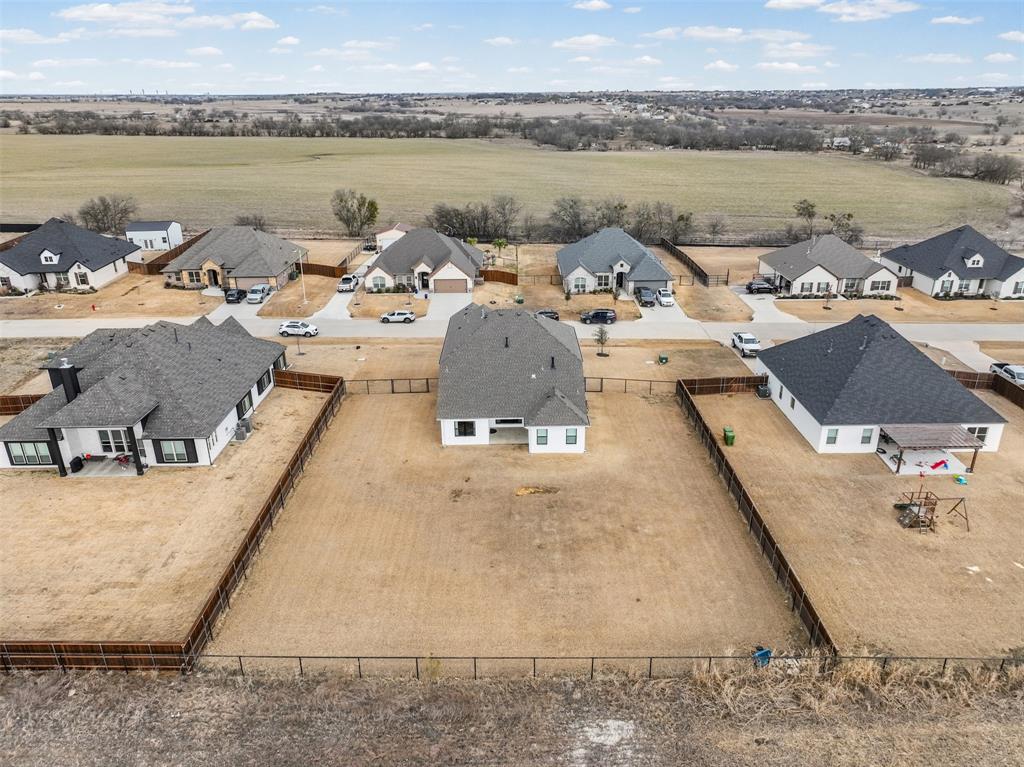 9437 Wildcat Ridge Godley, TX 76044 - Photo 32 of 37 a view of a lake with houses