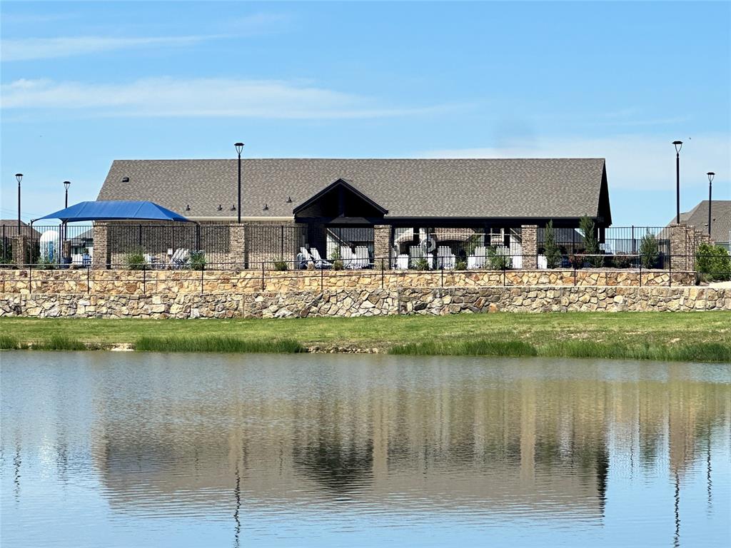 9437 Wildcat Ridge Godley, TX 76044 - Photo 33 of 37 a front view of a house with a lake view