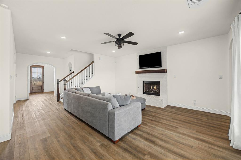 9437 Wildcat Ridge Godley, TX 76044 - Photo 7 of 37 a living room with furniture fireplace and flat screen tv