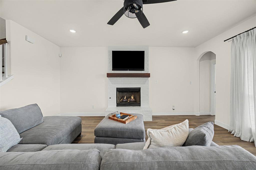 9437 Wildcat Ridge Godley, TX 76044 - Photo 8 of 37 a living room with furniture and a flat screen tv