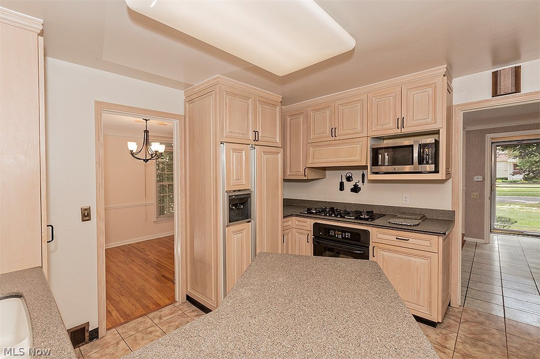 3680 Stoneleigh Road Cleveland, OH 44121 - Photo 17 of 34 Notice the paneled doors on the refrigerator...such a handsome Kitchen!