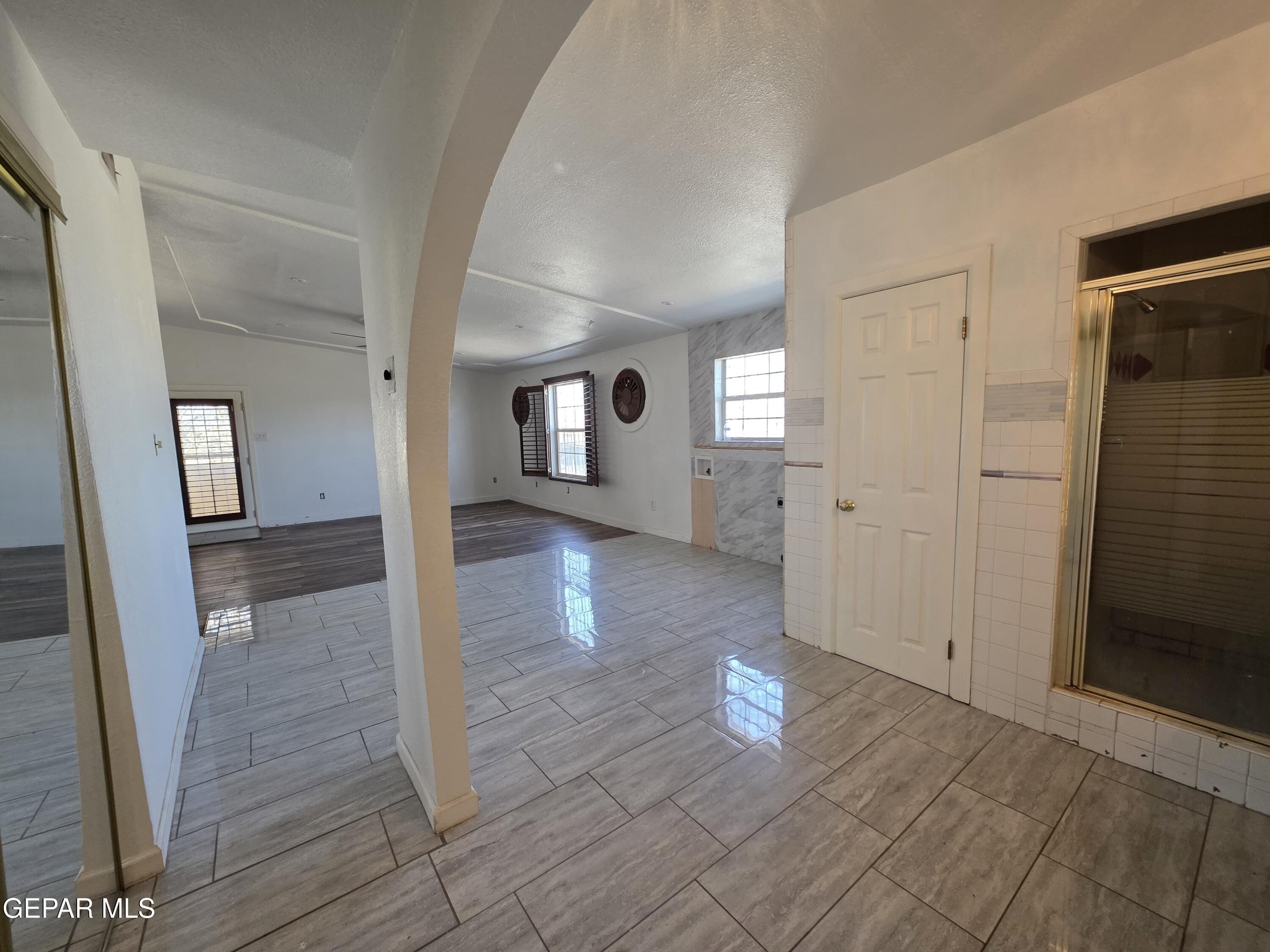 11661 Socorro Road Socorro, TX 79927 - Photo 32 of 33 wooden floor with a view of empty room