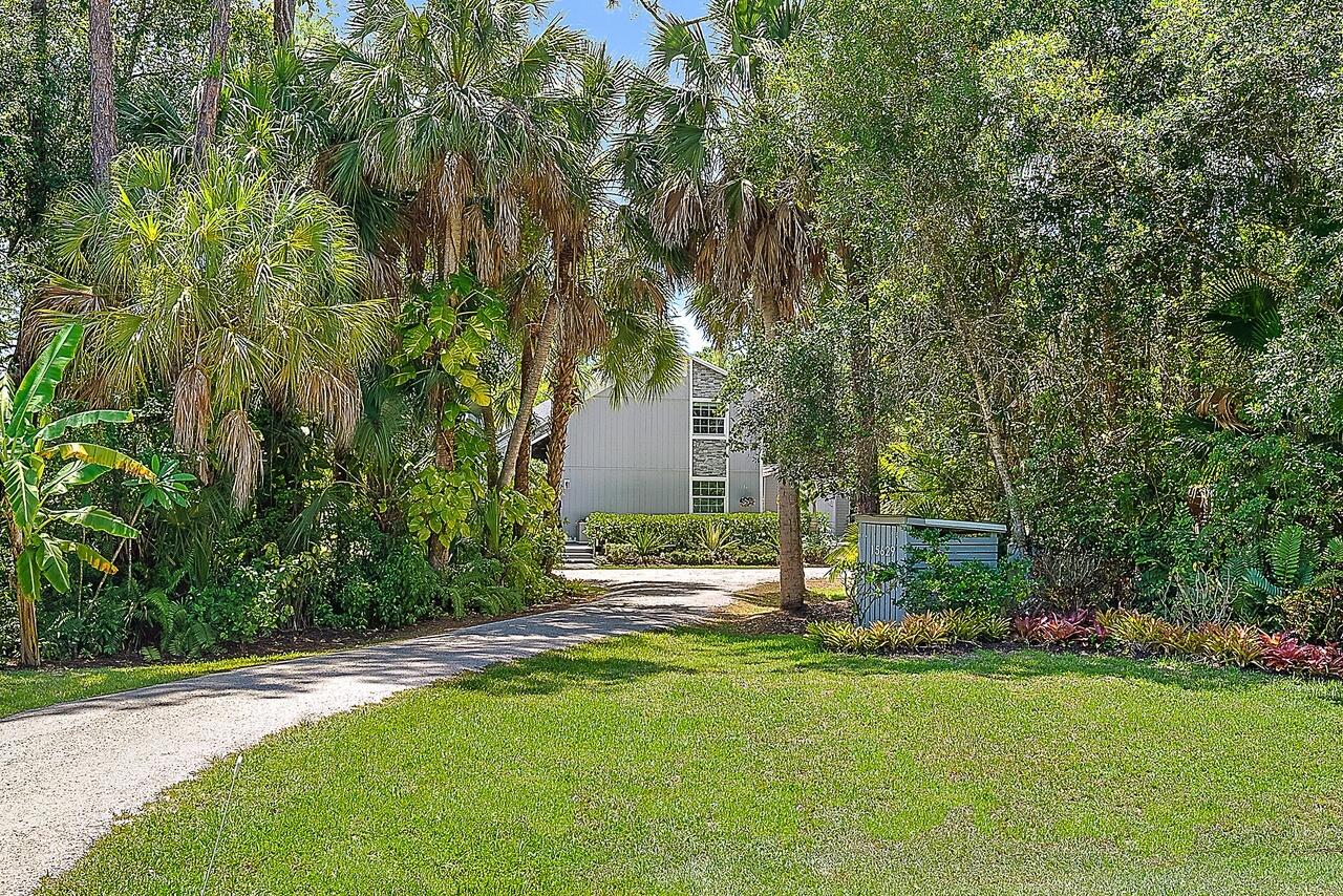 15629 95th Avenue North Jupiter, FL 33478 - Photo 18 of 22 a house view with a sitting space and garden