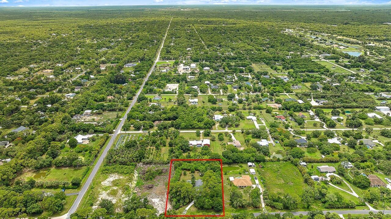 15629 95th Avenue North Jupiter, FL 33478 - Photo 21 of 22 a view of an outdoor space with a lake view