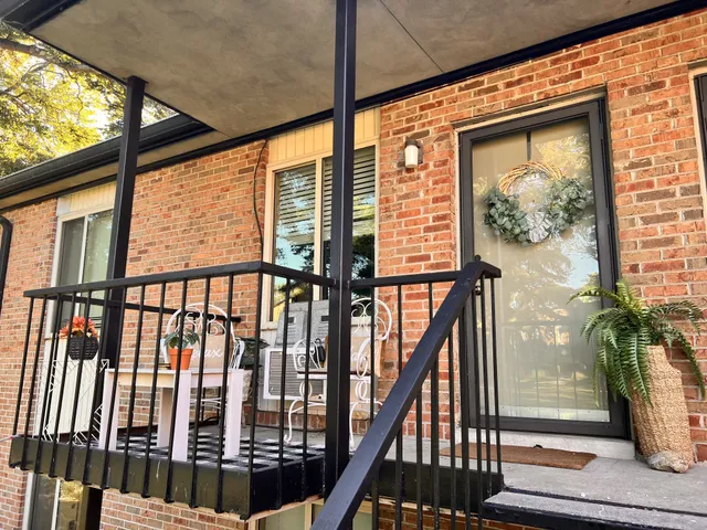 a view of staircase with wooden floor and a window