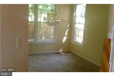 9104 Piper Ridge Court Lanham, MD 20706 - Photo 4 of 4 a view of an empty room with a window