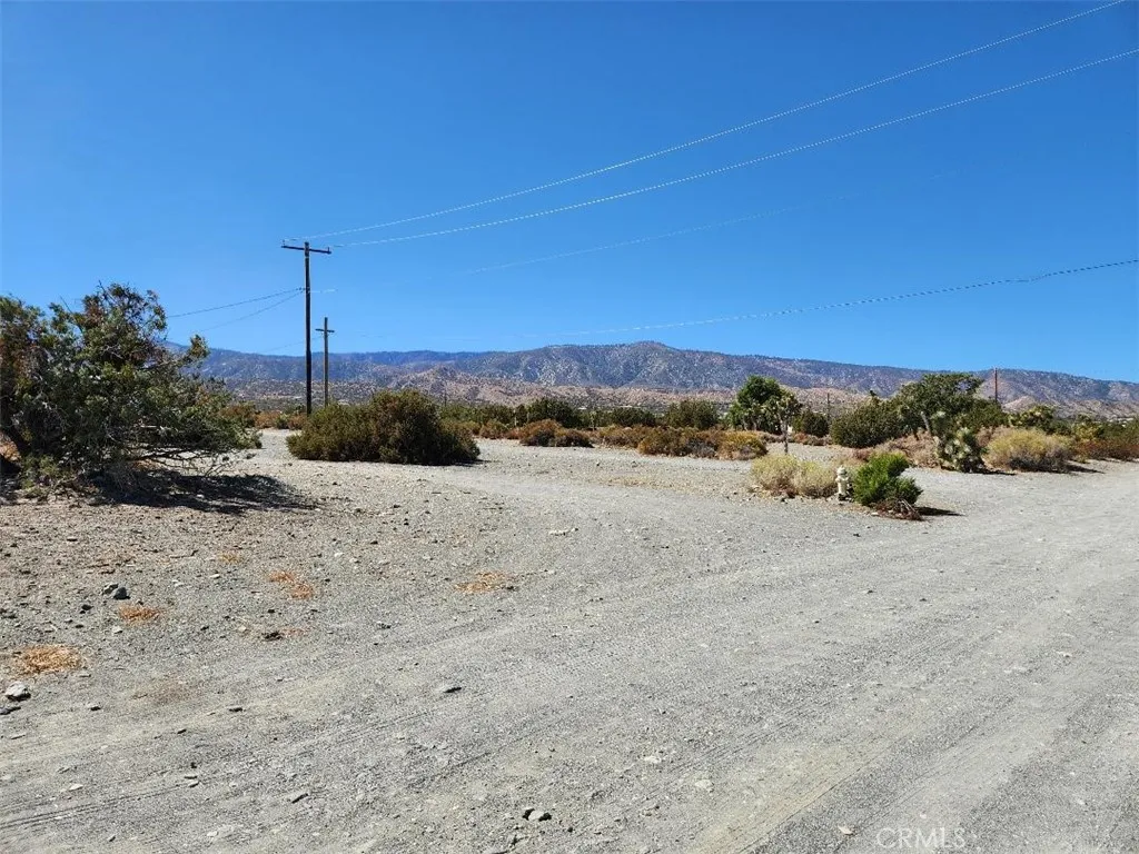 12 Cambria Road Pinon Hills, CA 92372 - Photo 12 of 12 a view of a road with a building in the background