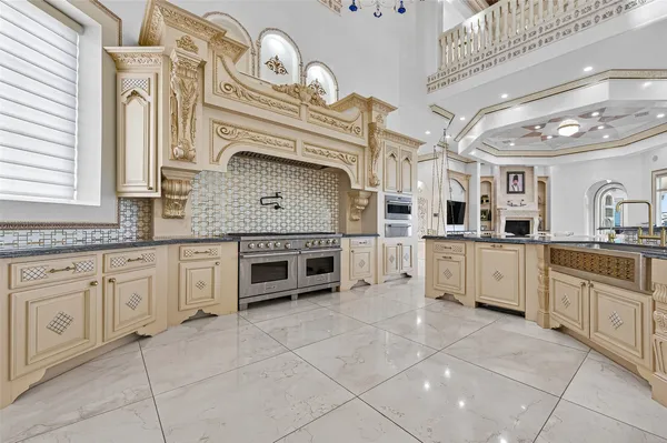 a kitchen with stainless steel appliances granite countertop a sink and cabinets