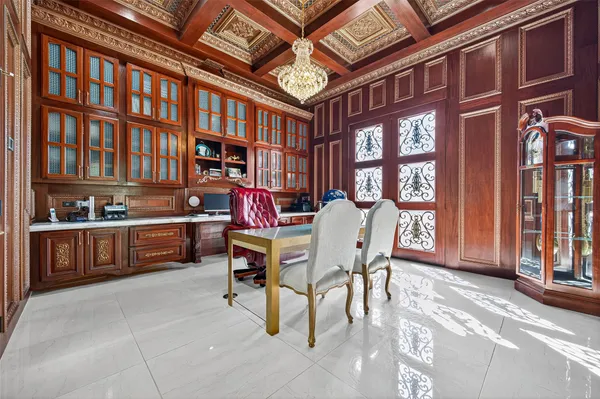 a view of a living room and entryway with furniture