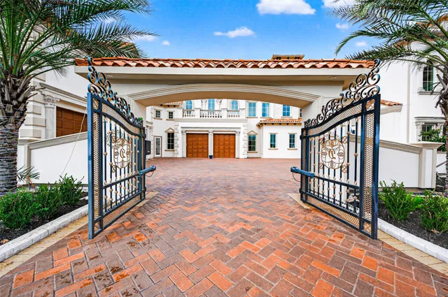 a front view of a house with swimming pool and a fire pit