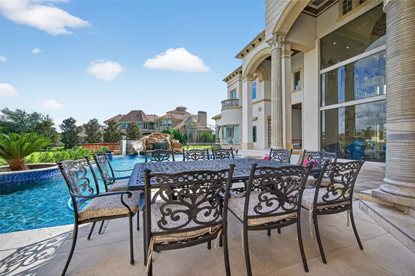 a view of a chairs and table in the patio