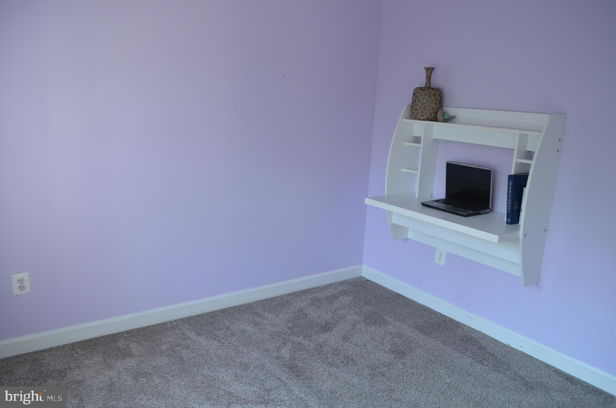 6505 Springwater Court, Unit 7403 Frederick, MD 21701 - Photo 13 of 39 1st bedoom with built in desk