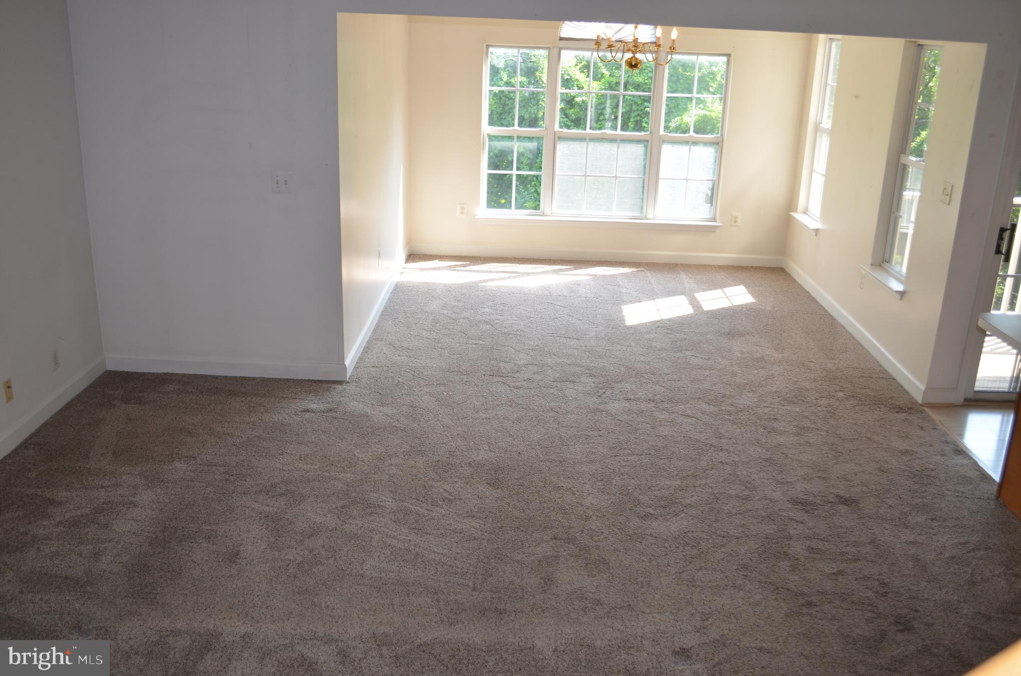 6505 Springwater Court, Unit 7403 Frederick, MD 21701 - Photo 8 of 39 Living room and dining room