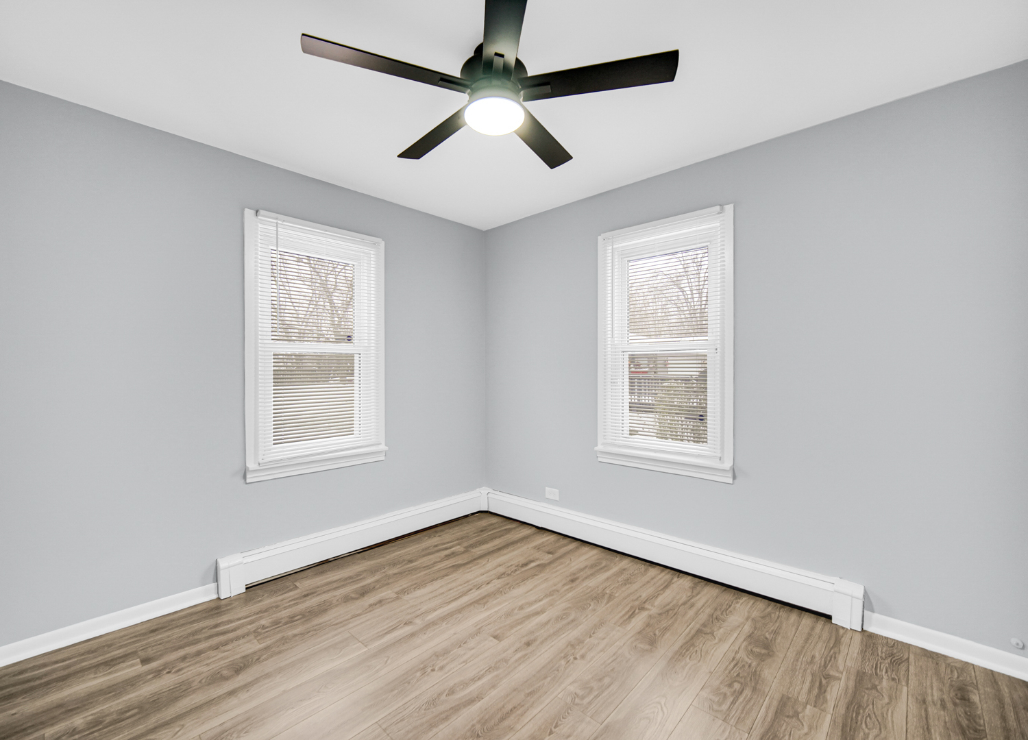 3009 Olive Road Homewood, IL 60430 - Photo 13 of 23 an empty room with wooden floor ceiling fan and windows