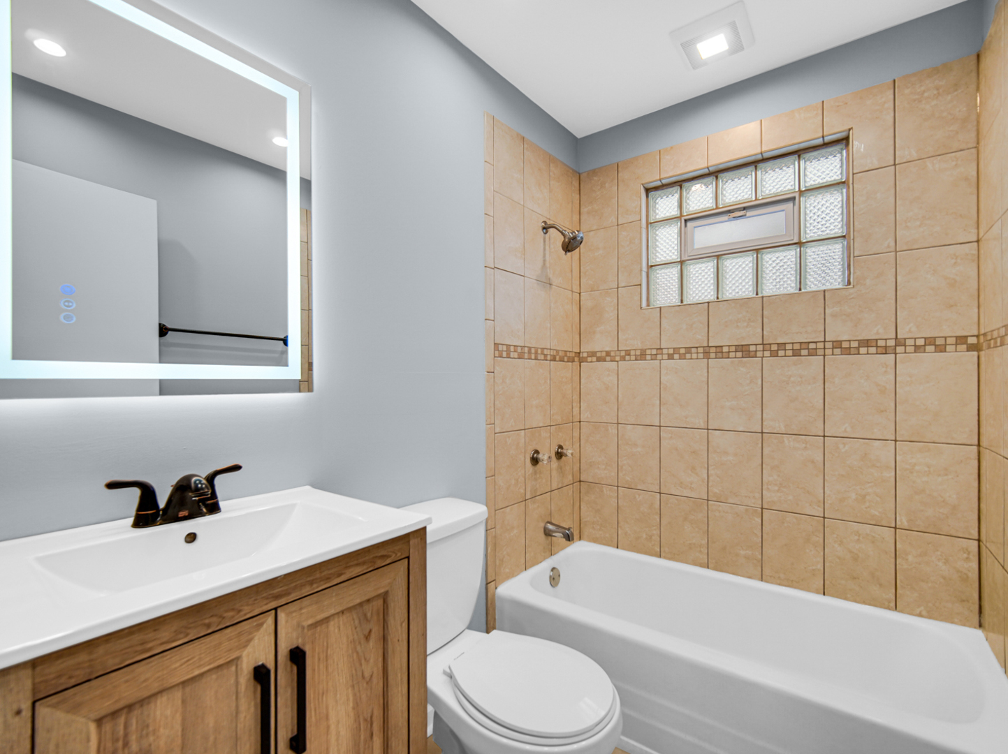 3009 Olive Road Homewood, IL 60430 - Photo 4 of 23 a bathroom with a sink a toilet and shower