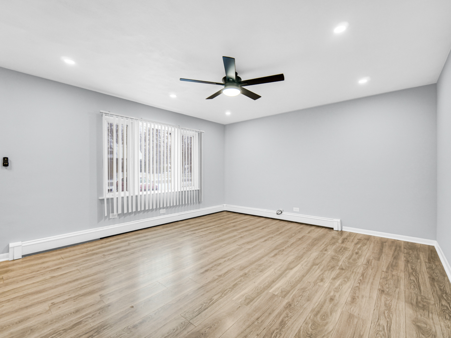 3009 Olive Road Homewood, IL 60430 - Photo 6 of 23 a view of an empty room with a window and wooden floor