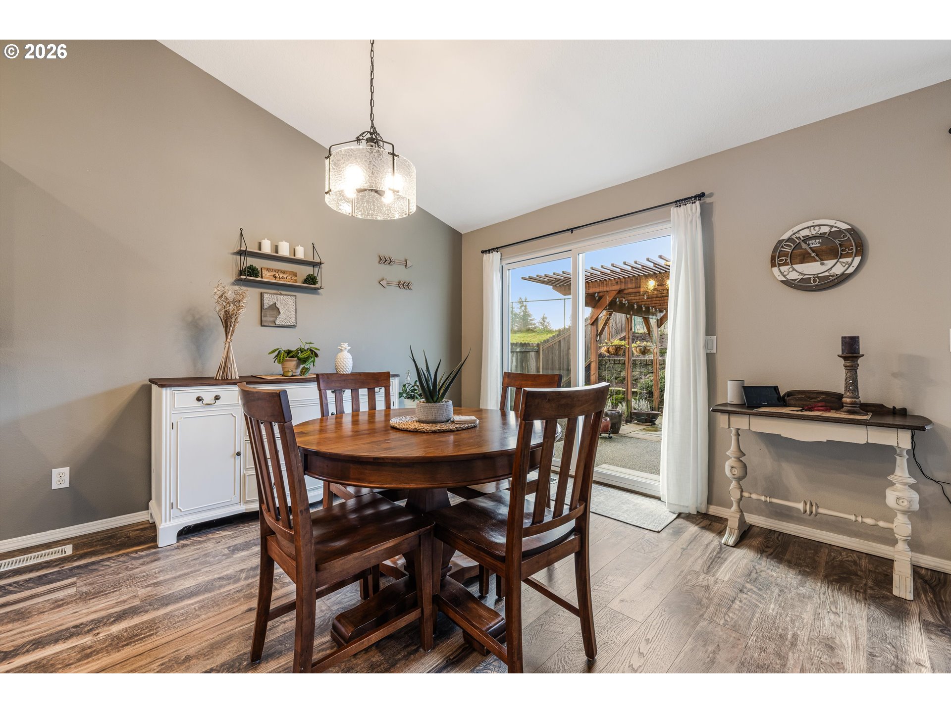 11769 Payson Lane Oregon City, OR 97045 - Photo 16 of 29 a view of a dining room with furniture window and wooden floor