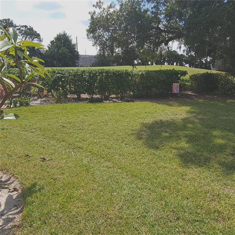 9344 Links Lane, Unit 9344 New Port Richey, FL 34655 - Photo 17 of 40 a view of lake with green space